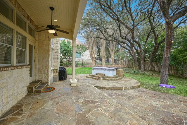 view of patio with entry steps, ceiling fan, a grill, and a fenced backyard