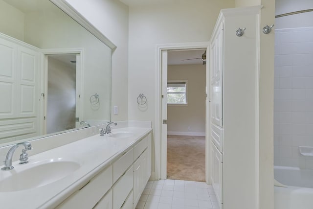 bathroom featuring double vanity, tile patterned flooring, and a sink