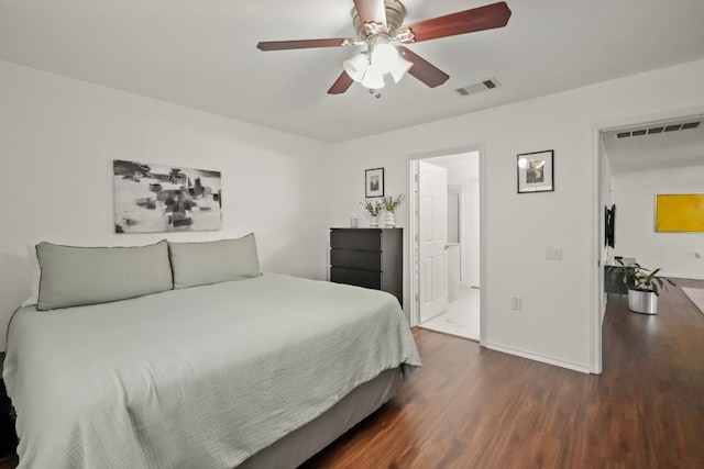 bedroom featuring dark wood-style floors, baseboards, visible vents, and a ceiling fan