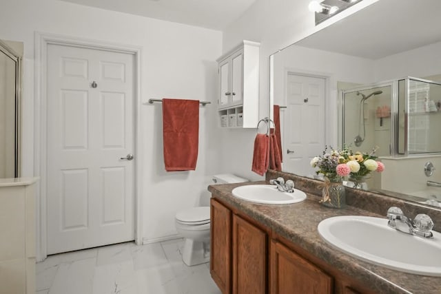 full bathroom with double vanity, marble finish floor, a sink, and a stall shower