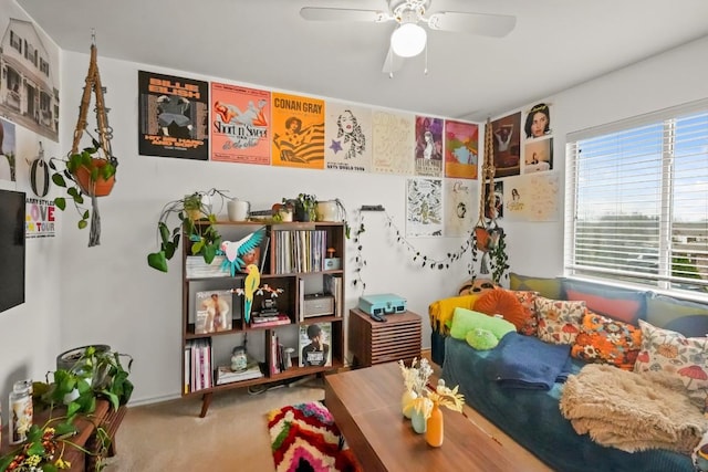 interior space with carpet flooring and ceiling fan