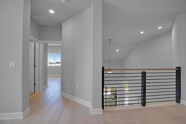 hall featuring recessed lighting, wood finished floors, visible vents, and baseboards