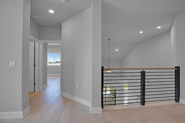 16909 Roselin Dr, Austin, TX 78738 - hall with wood finished floors, baseboards, recessed lighting, and vaulted ceiling