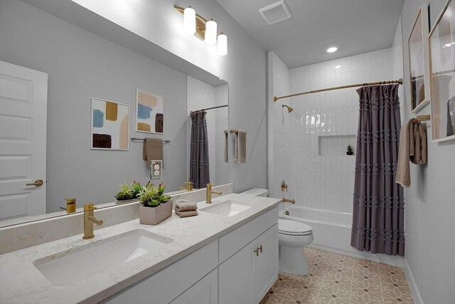 full bath with a sink, visible vents, toilet, and shower / bath combo