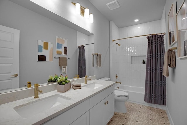 16909 Roselin Dr, Austin, TX 78738 - bathroom with toilet, double vanity, shower / bath combo with shower curtain, and recessed lighting