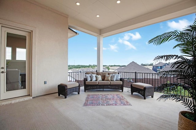 view of patio with a balcony and an outdoor hangout area