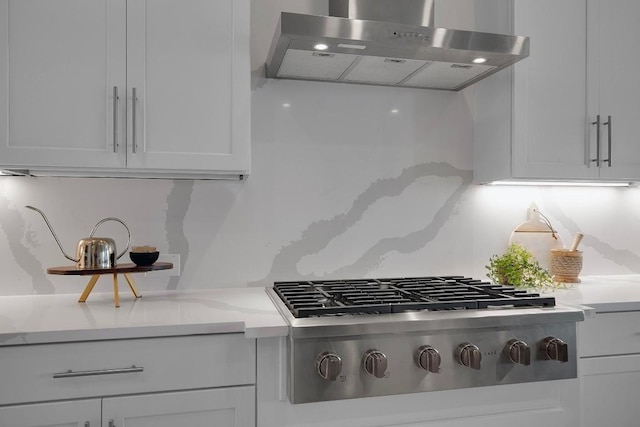 16909 Roselin Dr, Austin, TX 78738 - kitchen with ventilation hood, stainless steel gas stovetop, light countertops, and white cabinetry