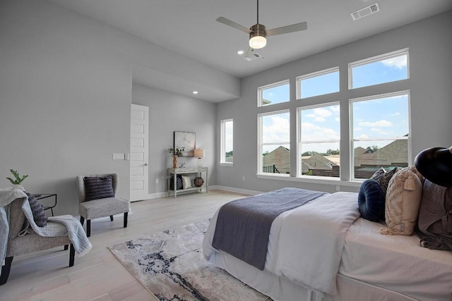 bedroom with visible vents, light wood-style flooring, a ceiling fan, recessed lighting, and baseboards