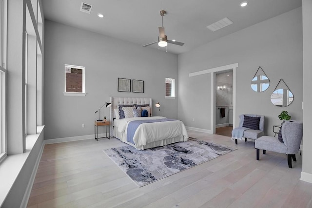 16909 Roselin Dr, Austin, TX 78738 - bedroom with light wood finished floors, recessed lighting, baseboards, connected bathroom, and a ceiling fan