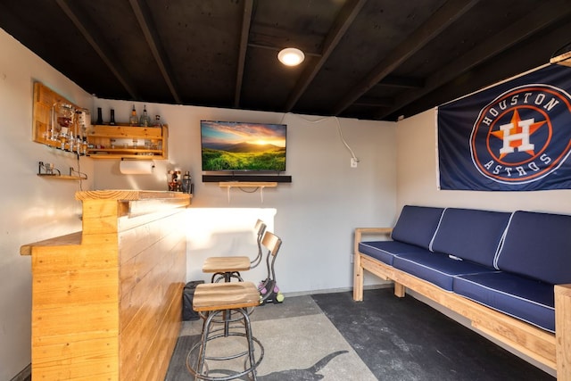 bar featuring a dry bar and concrete floors