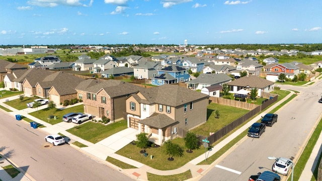 birds eye view of property with a residential view