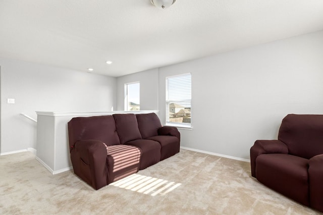 living room featuring recessed lighting, carpet, and baseboards