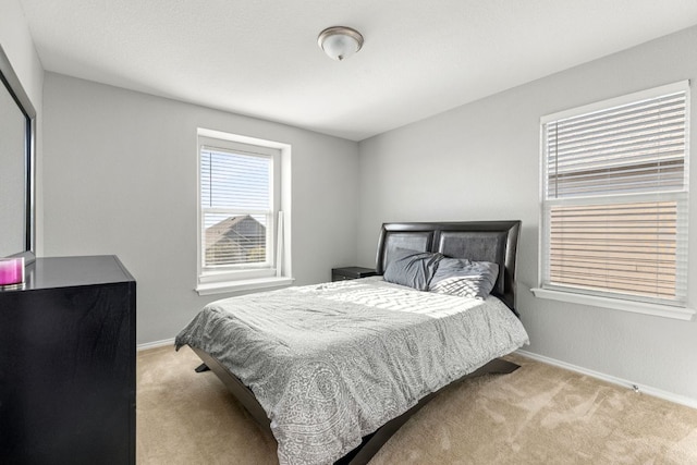 carpeted bedroom with baseboards