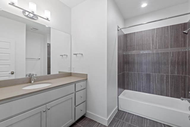 full bath featuring vanity, baseboards, shower / washtub combination, and tile patterned floors