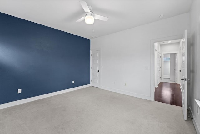 unfurnished bedroom featuring carpet flooring, ceiling fan, and baseboards