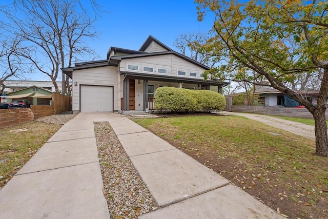 view of front of property with a porch, a garage, fence, concrete driveway, and a front lawn