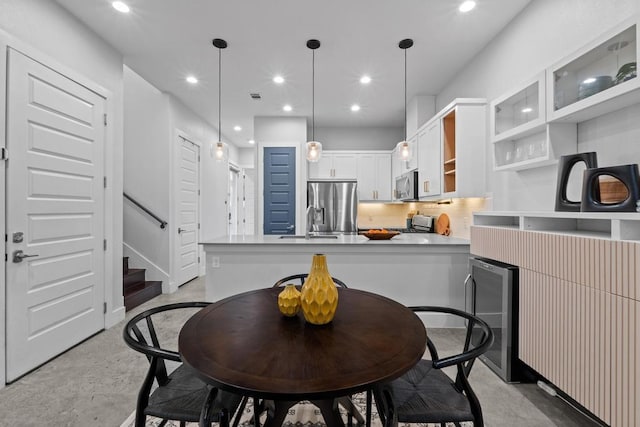 dining space featuring stairs, visible vents, and recessed lighting