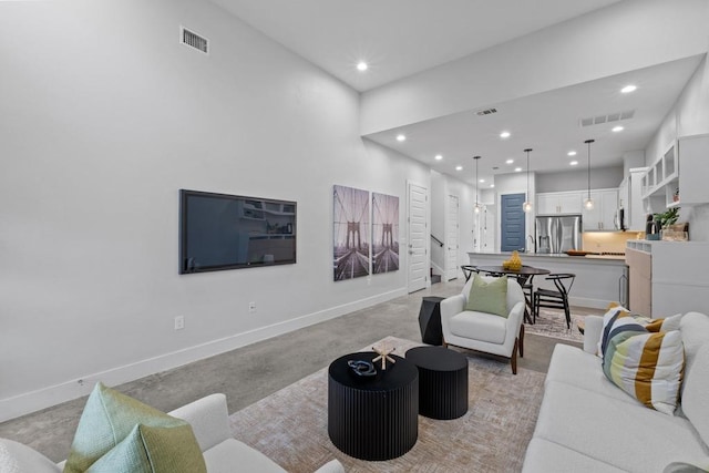 living room featuring recessed lighting, visible vents, stairway, and baseboards