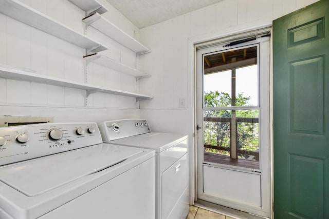 laundry room with washing machine and clothes dryer and laundry area