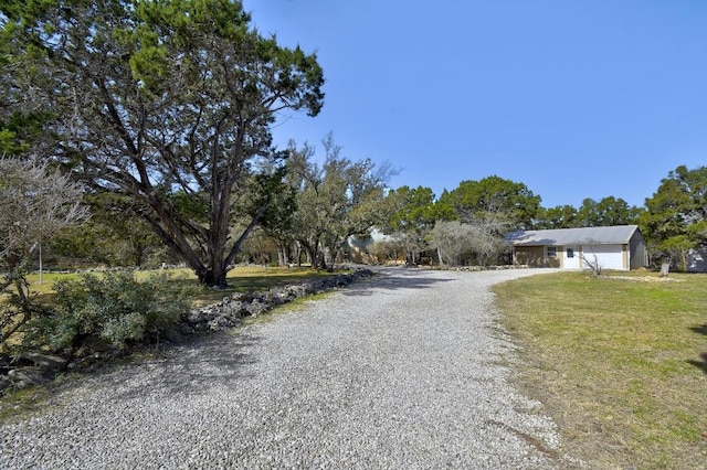 view of road featuring driveway