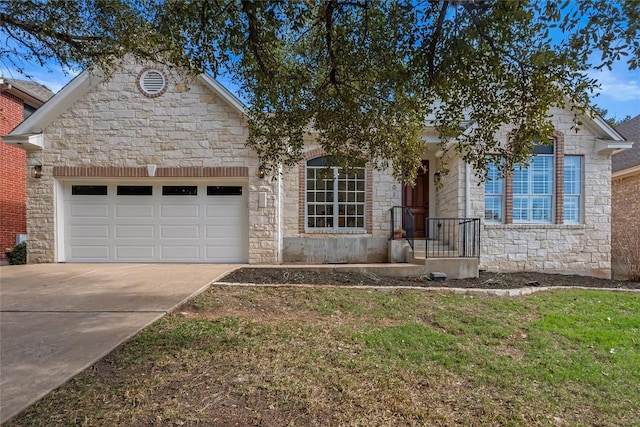 view of front of home with stone siding, concrete driveway, and an attached garage