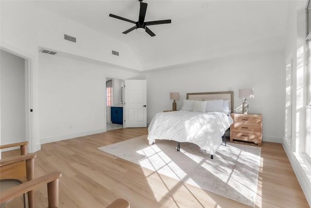 bedroom featuring light wood-type flooring, visible vents, and baseboards