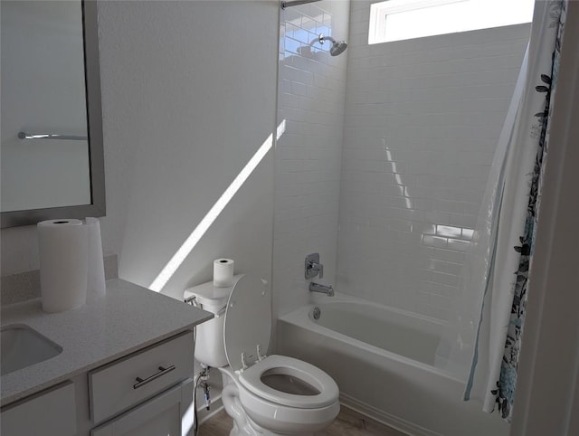 full bath with shower / bath combination with curtain, vanity, and toilet