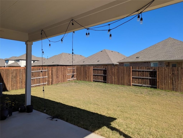 view of yard with a patio area and a fenced backyard