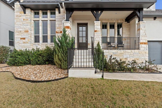 property entrance with stone siding, covered porch, and a yard