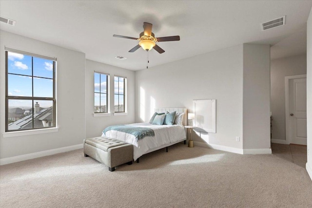 bedroom featuring baseboards, visible vents, and carpet flooring