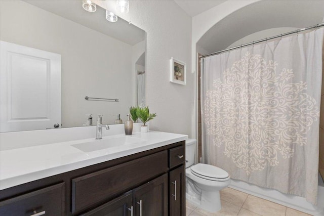 full bathroom with tile patterned flooring, vanity, toilet, and shower / bath combo