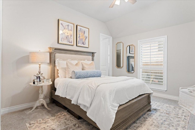 bedroom with vaulted ceiling, carpet floors, a ceiling fan, and baseboards