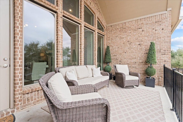 view of patio featuring a balcony and outdoor lounge area