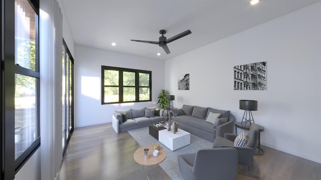 living area with a ceiling fan, baseboards, wood finished floors, and recessed lighting