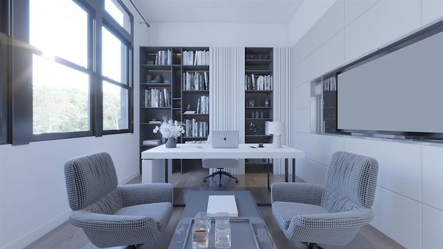 office featuring a healthy amount of sunlight, tile walls, and wood finished floors