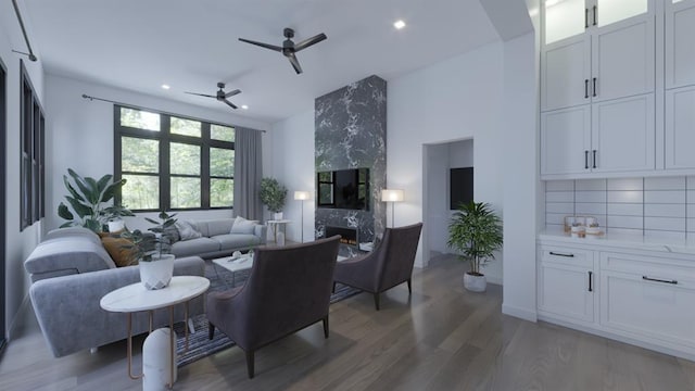 living room featuring recessed lighting, light wood-style floors, ceiling fan, and a high end fireplace