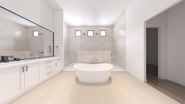 bathroom featuring a freestanding bath, vanity, and walk in shower