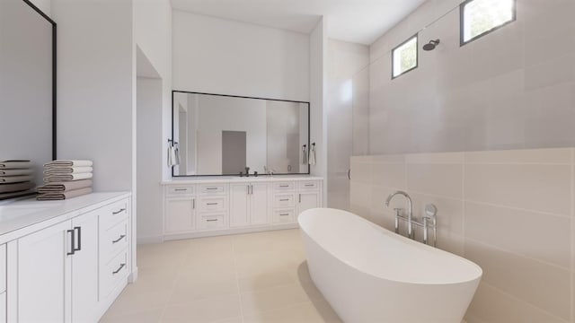 full bath featuring tile patterned floors, a freestanding bath, vanity, a walk in shower, and tile walls