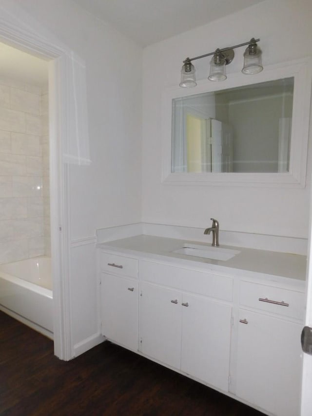 bathroom featuring wood finished floors and vanity