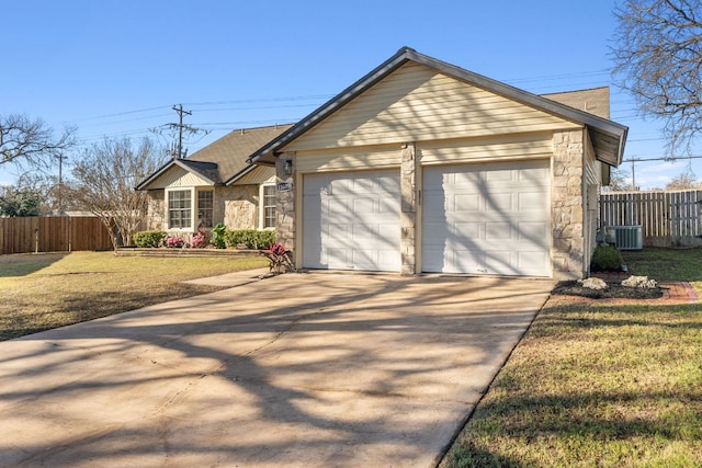 single story home with stone siding, a front lawn, fence, and driveway