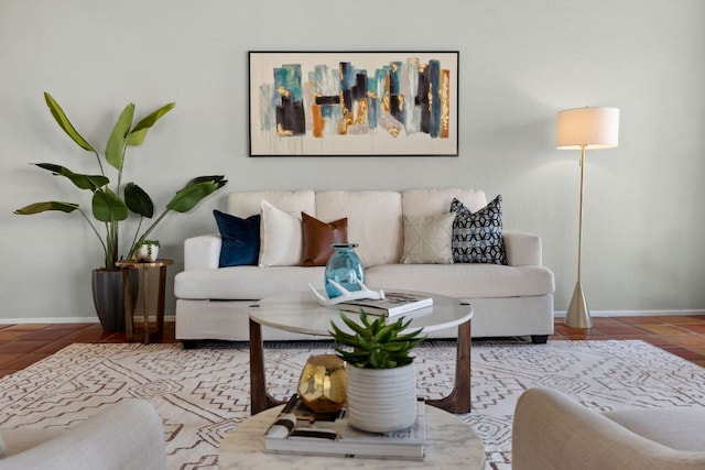 tiled living area with baseboards