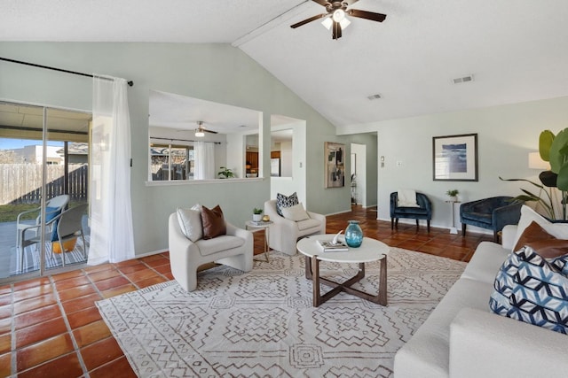 tiled living area with a ceiling fan, visible vents, and vaulted ceiling