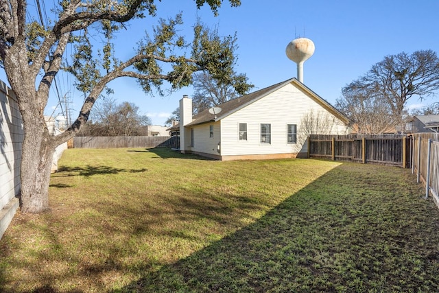 view of yard with a fenced backyard