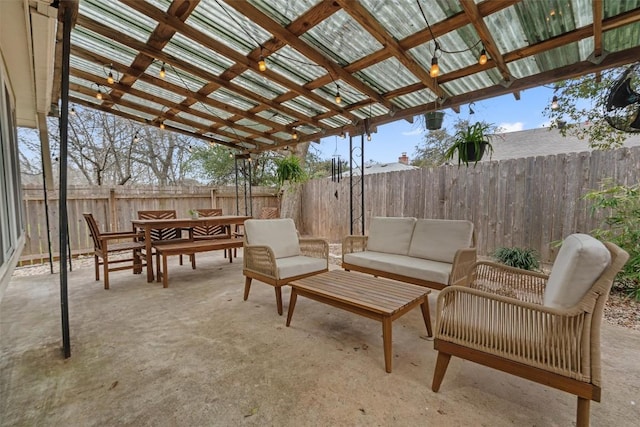 view of patio / terrace with outdoor dining area, outdoor lounge area, a fenced backyard, and a pergola