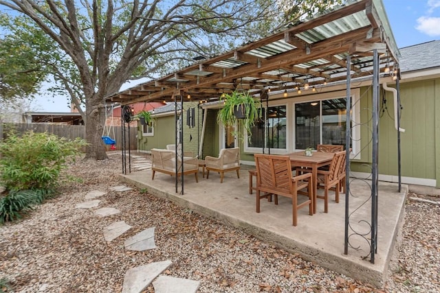 view of patio / terrace with outdoor lounge area and fence