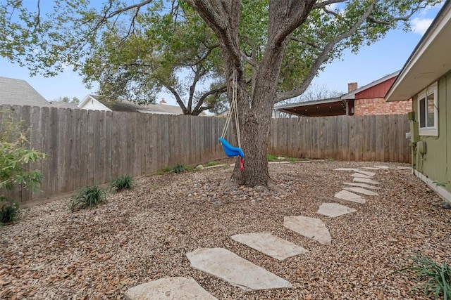 view of yard with a fenced backyard