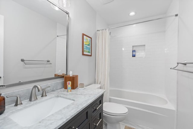 bathroom featuring recessed lighting, vanity, toilet, and shower / tub combo with curtain