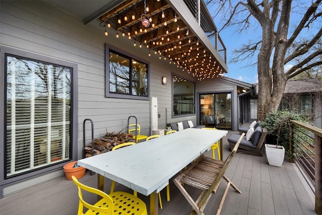 wooden deck featuring outdoor dining space