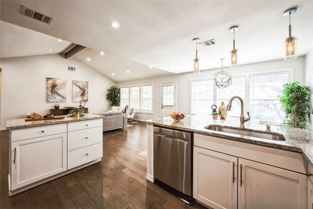 kitchen featuring dishwasher, a sink, visible vents, and dark wood-style floors