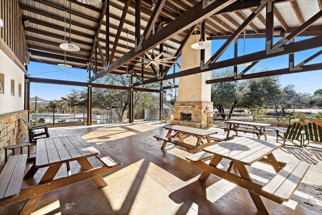 view of patio / terrace featuring an outdoor stone fireplace